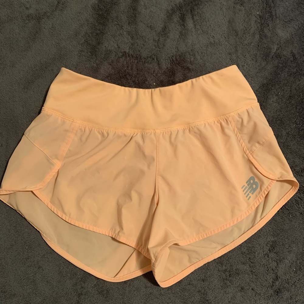 New Balance Impact Run 3” light orange running shorts